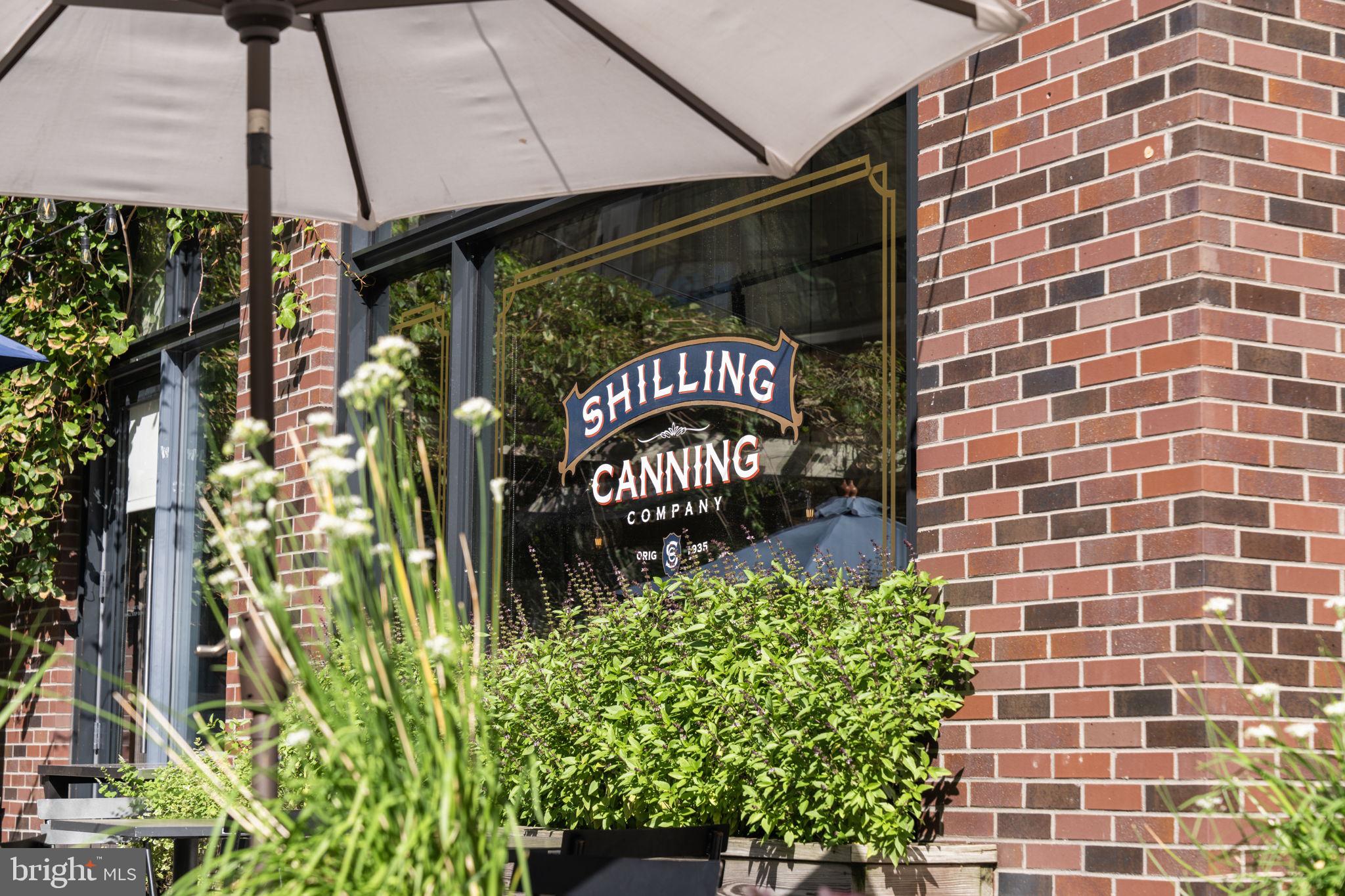 355 I Street Southwest, Unit S104 Washington, DC 20024 - Photo 62 of 64 a sign that is in front of flowers