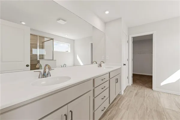 a bathroom with a bathtub and a sink