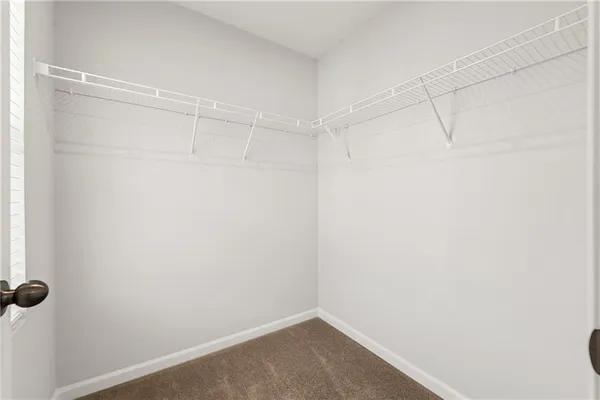 a bathroom with a double vanity sink toilet and shower