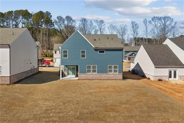 a view of a house with a yard and mountain view