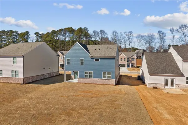 a view of a house with a snow in the background