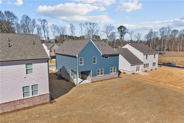 an aerial view of residential houses with outdoor space