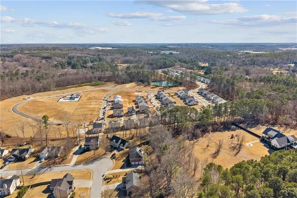 an aerial view of residential houses with outdoor space