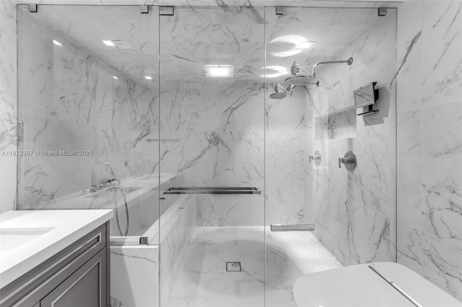 10 Venetian Way, Unit 1903 Miami Beach, FL 33139 - Photo 24 of 49 a bathroom with a bathtub and a shower