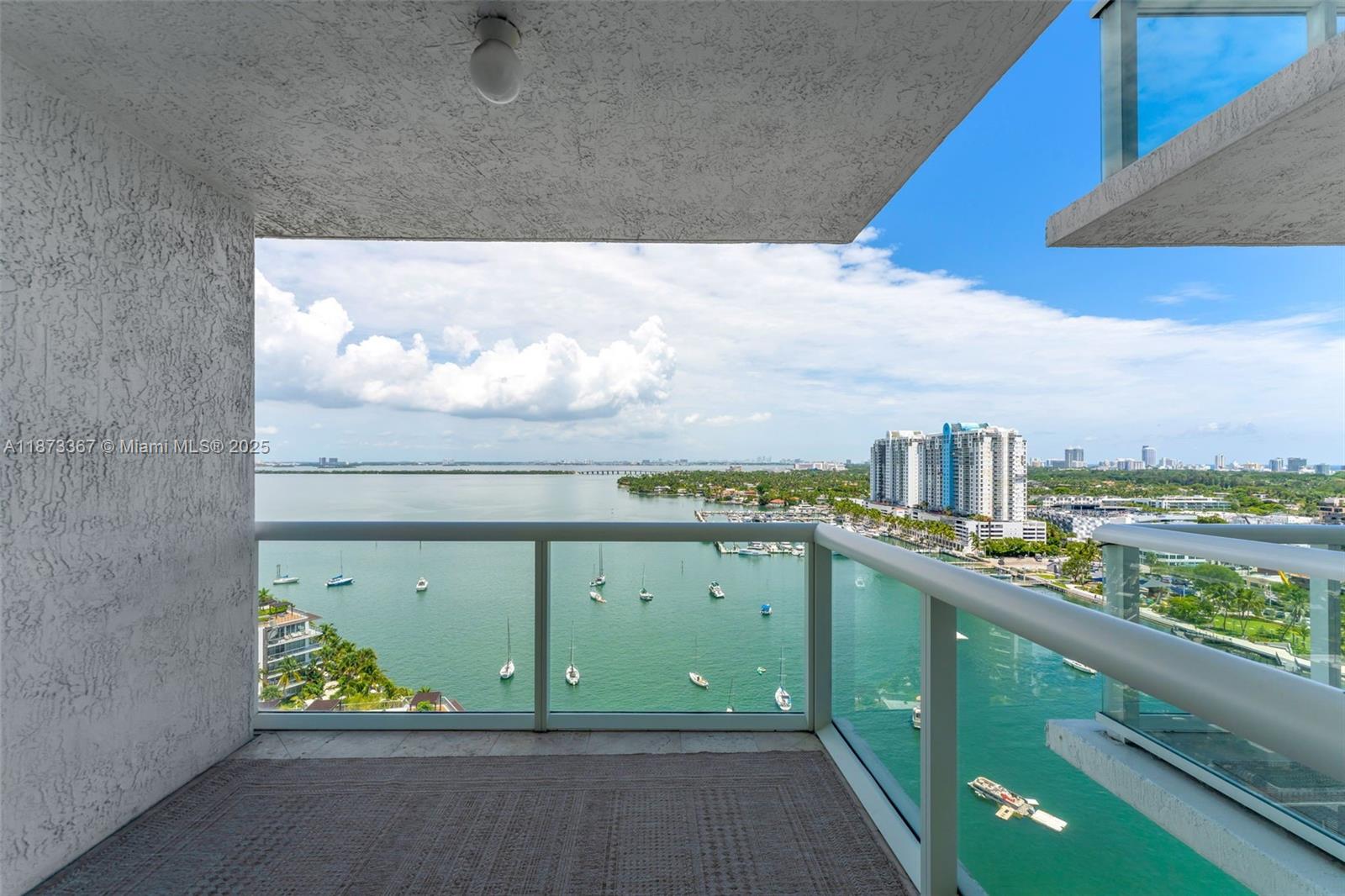 10 Venetian Way, Unit 1903 Miami Beach, FL 33139 - Photo 27 of 49 a view of a floor to ceiling window and a wooden floor