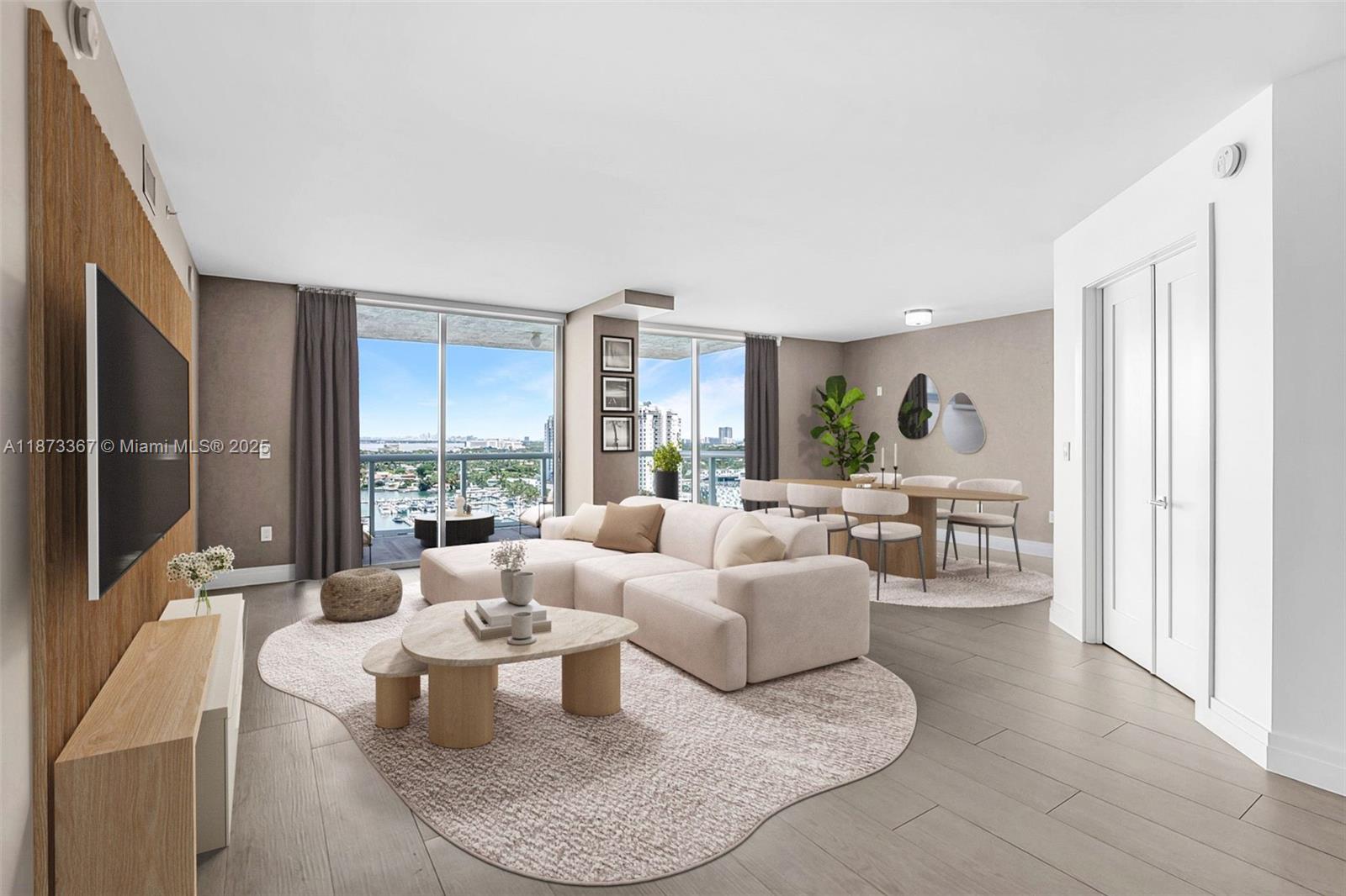10 Venetian Way, Unit 1903 Miami Beach, FL 33139 - Photo 3 of 49 a living room with furniture and a large window