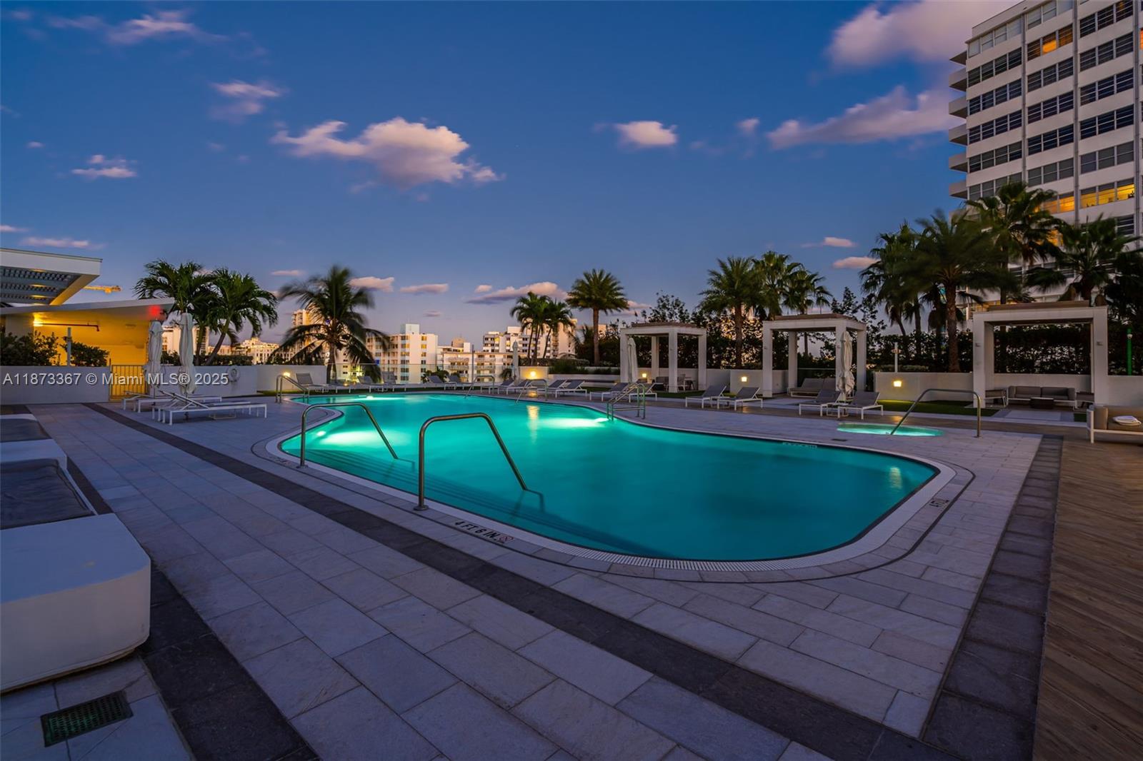 10 Venetian Way, Unit 1903 Miami Beach, FL 33139 - Photo 41 of 49 a view of a swimming pool with a patio