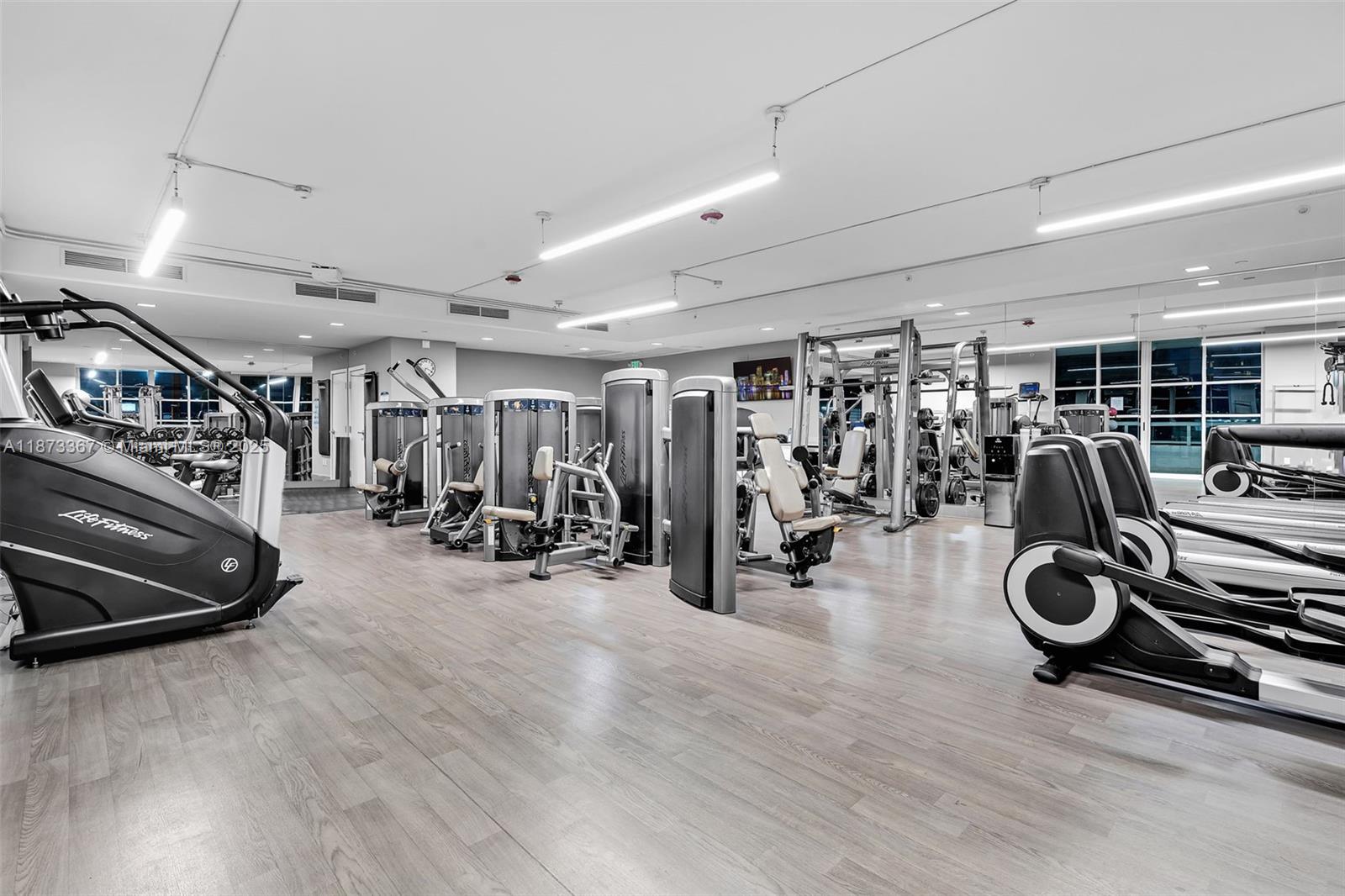 10 Venetian Way, Unit 1903 Miami Beach, FL 33139 - Photo 45 of 49 a view of a room with gym equipment