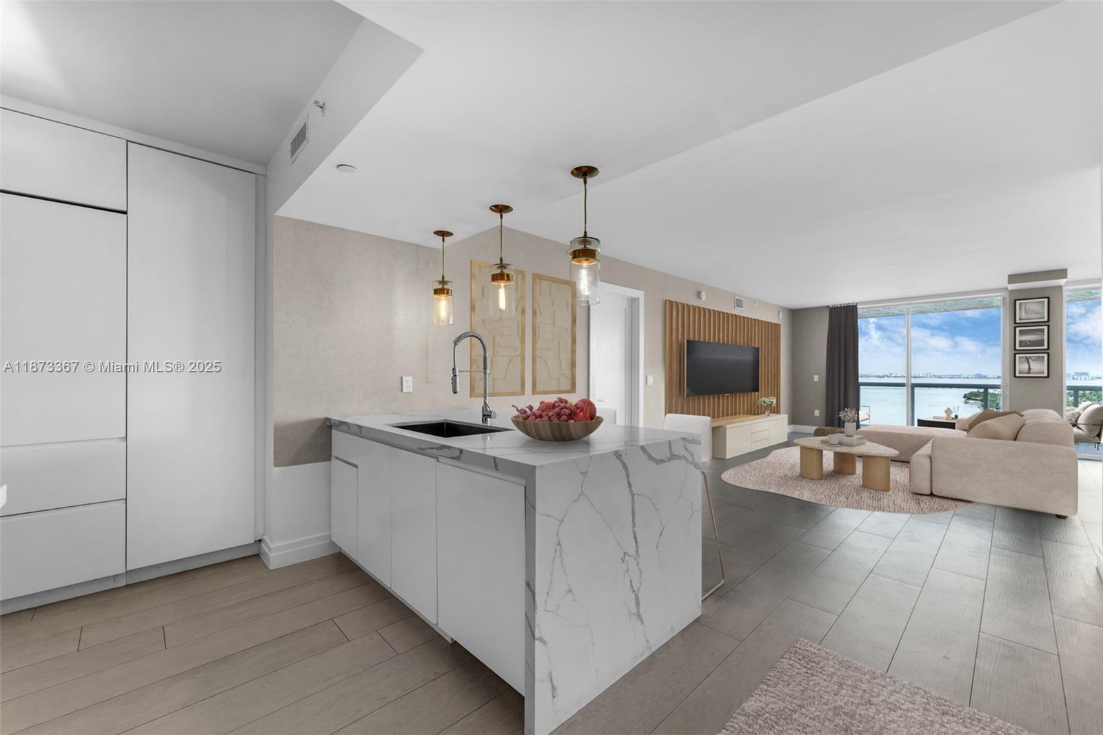 10 Venetian Way, Unit 1903 Miami Beach, FL 33139 - Photo 7 of 49 a living room with stainless steel appliances kitchen island furniture and a flat screen tv
