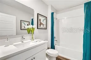 a bedroom with a large bed and a large window