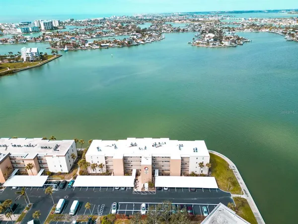 an aerial view of a house with a lake view