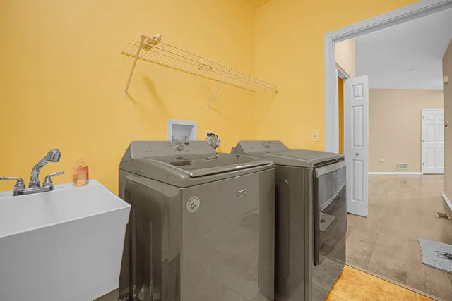 a utility room with dryer and washer
