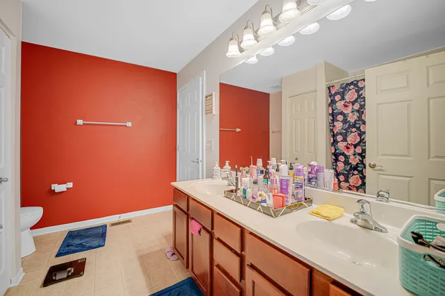 a bathroom with a sink vanity and a mirror