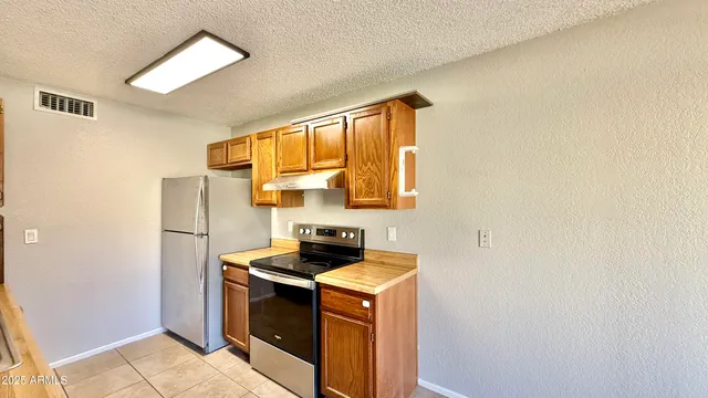 a utility room with sink dryer and washer