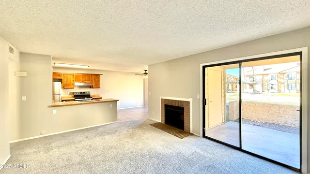 a view of open kitchen with wooden floor and electronic appliances