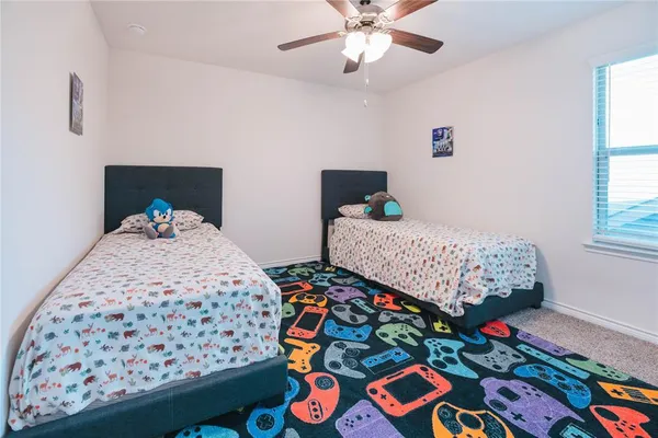 a bedroom with bed and a window