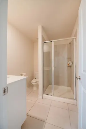 a bathroom with a shower and toilet