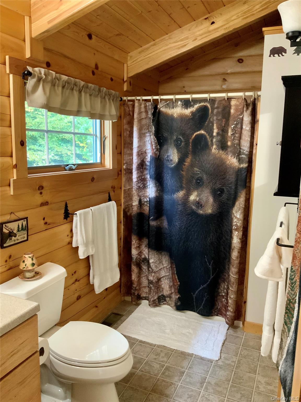 66 Milton Smith Road Long Eddy, NY 12760 - Photo 11 of 25 The full bathroom offers rustic finishes and a tub/shower combination.
