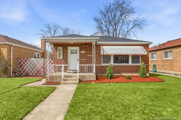 front view of a house with a yard