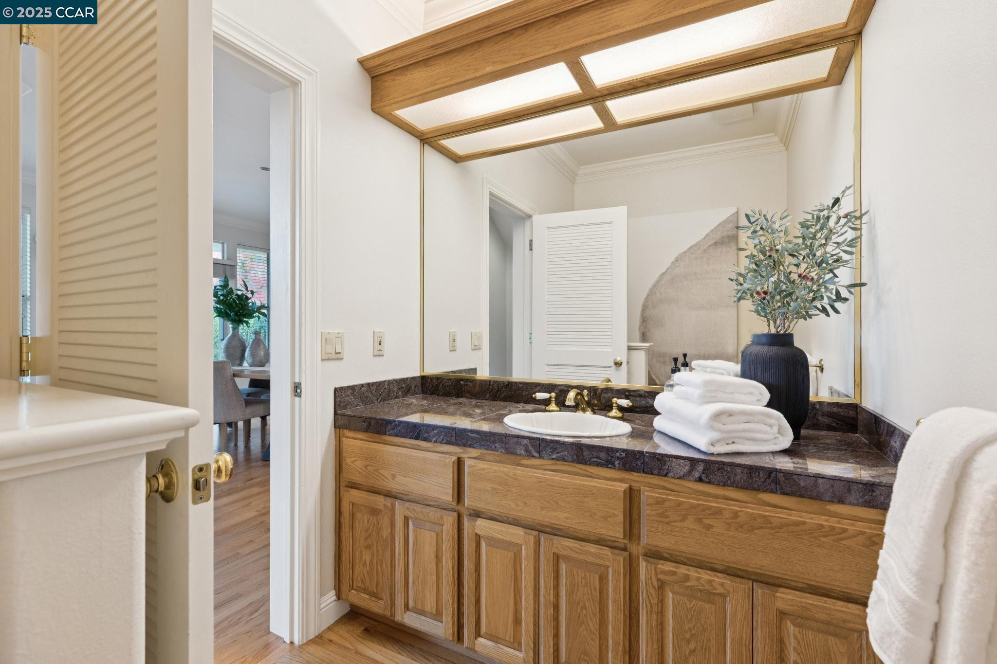 788 Woodwind Place Walnut Creek, CA 94598 - Photo 21 of 48 a bathroom with a granite countertop sink and a mirror