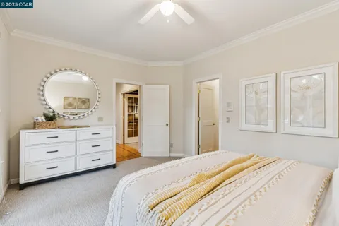 a bathroom with a granite countertop sink a toilet and a mirror