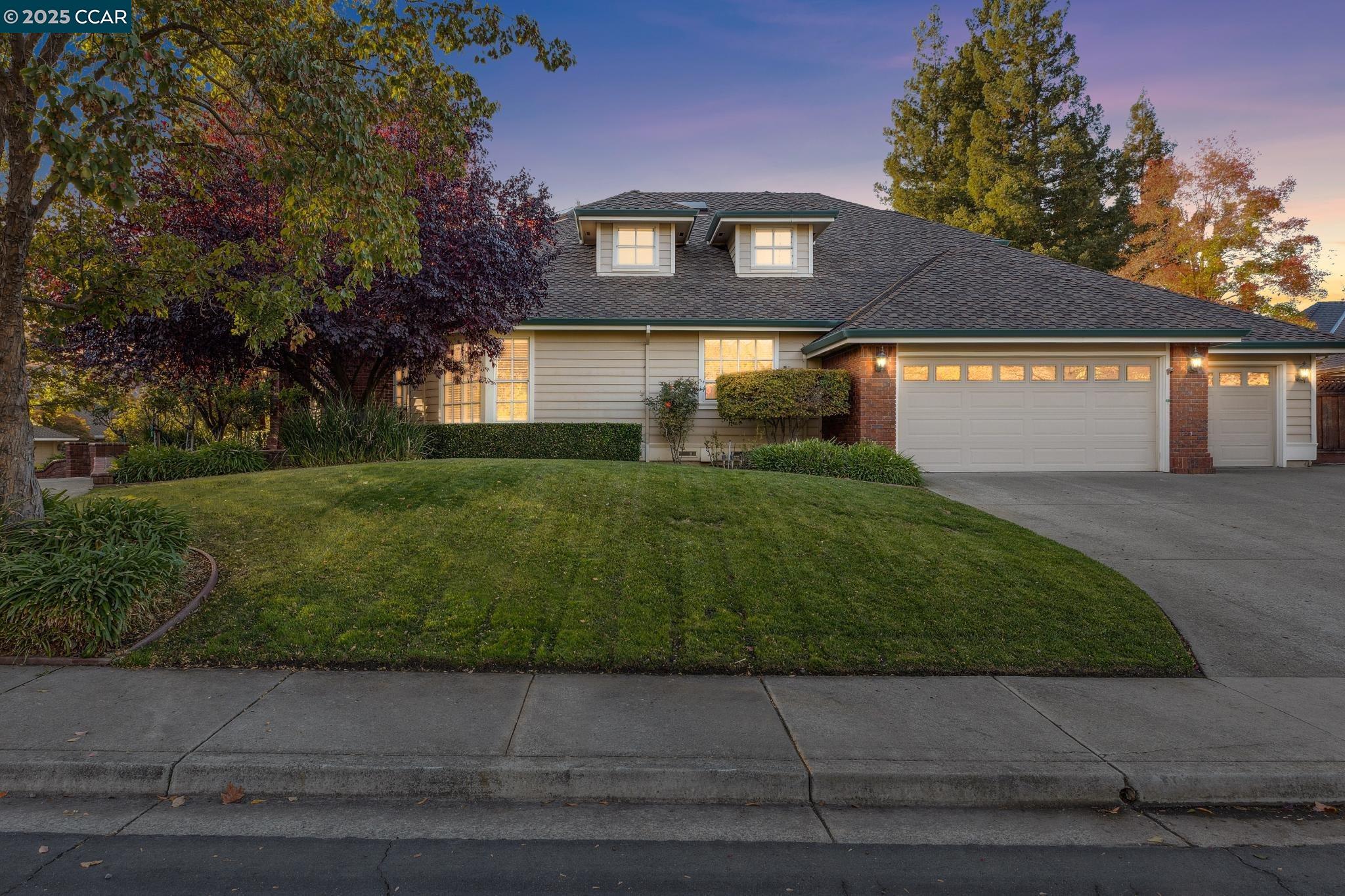 788 Woodwind Place Walnut Creek, CA 94598 - Photo 3 of 48 a front view of a house with a yard and garage