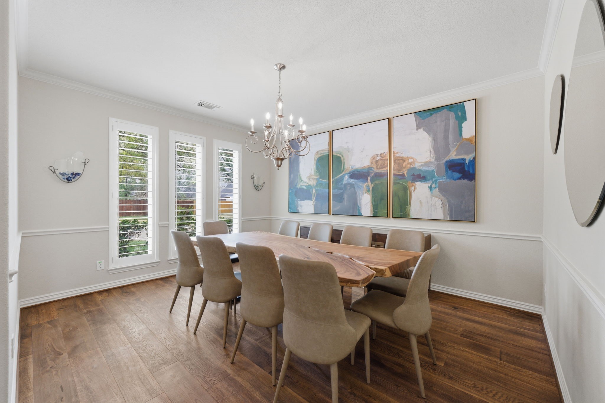 315 Arbor Ridge Lane Conroe, TX 77384 - Photo 5 of 48 a view of a dining room with furniture wooden floor and chandelier