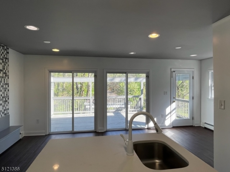 636 Valley Road Watchung, NJ 07069 - Photo 13 of 43 a living room with hardwood floor and a large window