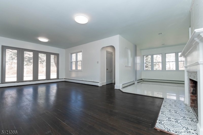 636 Valley Road Watchung, NJ 07069 - Photo 15 of 43 an empty room with wooden floor and windows