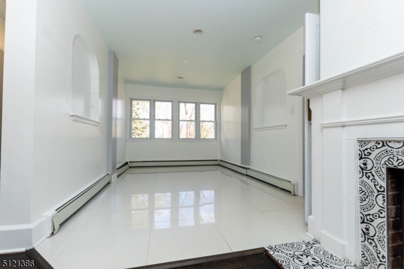 636 Valley Road Watchung, NJ 07069 - Photo 17 of 43 a view of an empty room and window