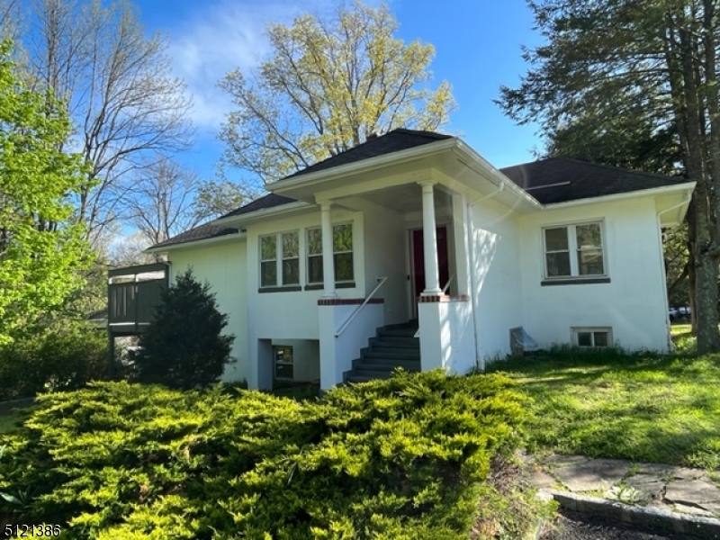 636 Valley Road Watchung, NJ 07069 - Photo 2 of 43 a front view of a house with a yard