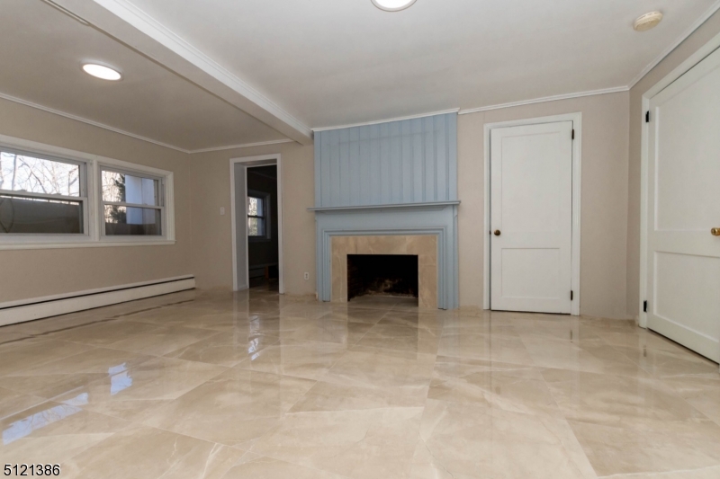 636 Valley Road Watchung, NJ 07069 - Photo 30 of 43 a view of an empty room with window and fire place