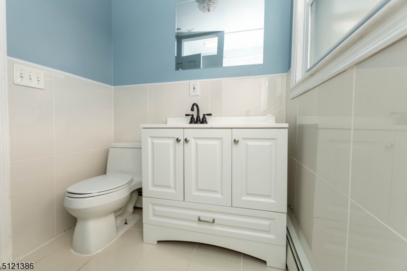 636 Valley Road Watchung, NJ 07069 - Photo 33 of 43 a bathroom with a sink toilet and mirror