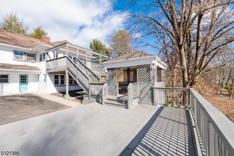 636 Valley Road Watchung, NJ 07069 - Photo 38 of 43 a view of house with outdoor seating and city view