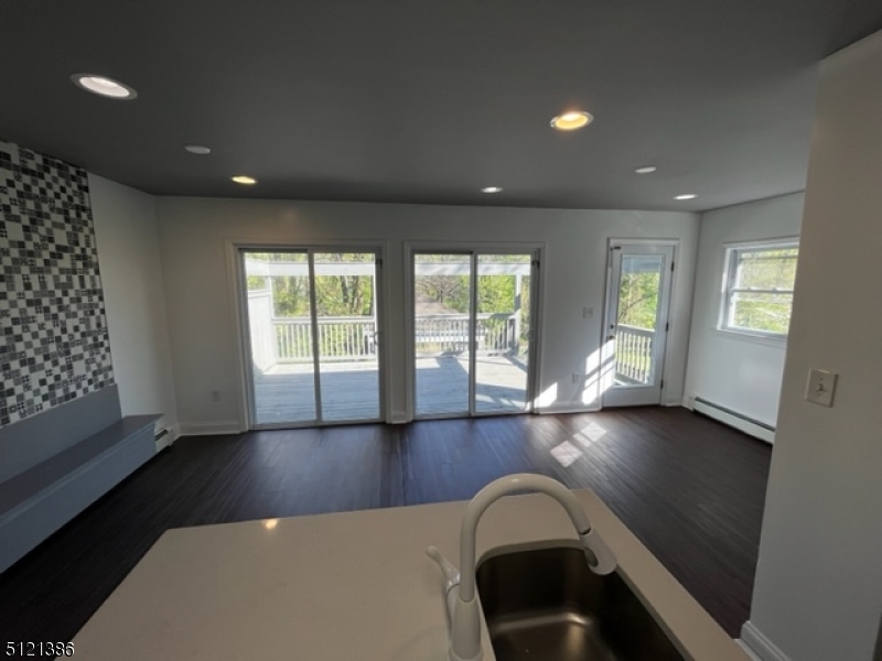 636 Valley Road Watchung, NJ 07069 - Photo 42 of 43 wooden floor in an empty room with a window