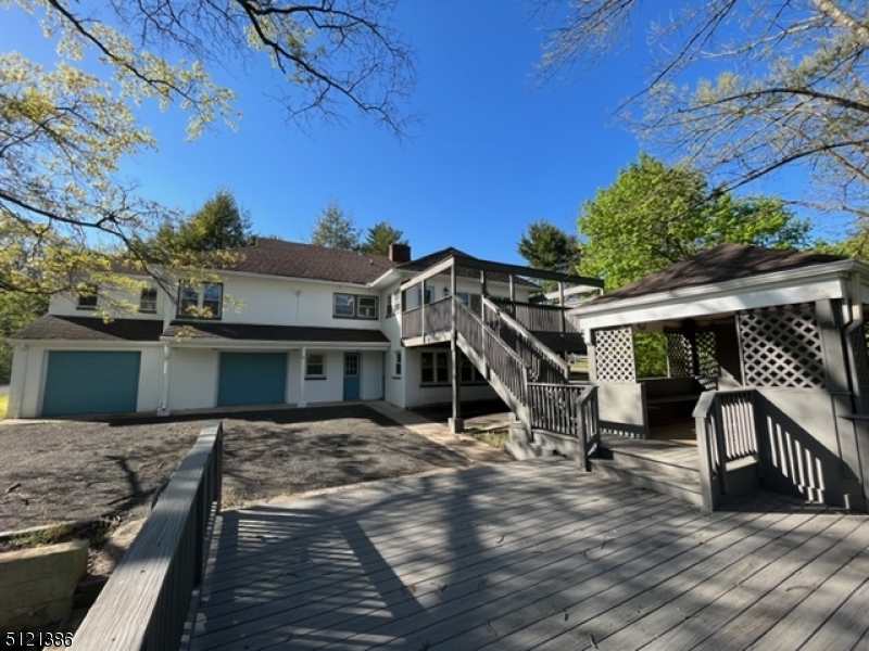 636 Valley Road Watchung, NJ 07069 - Photo 5 of 43 a view of a house with a wooden deck