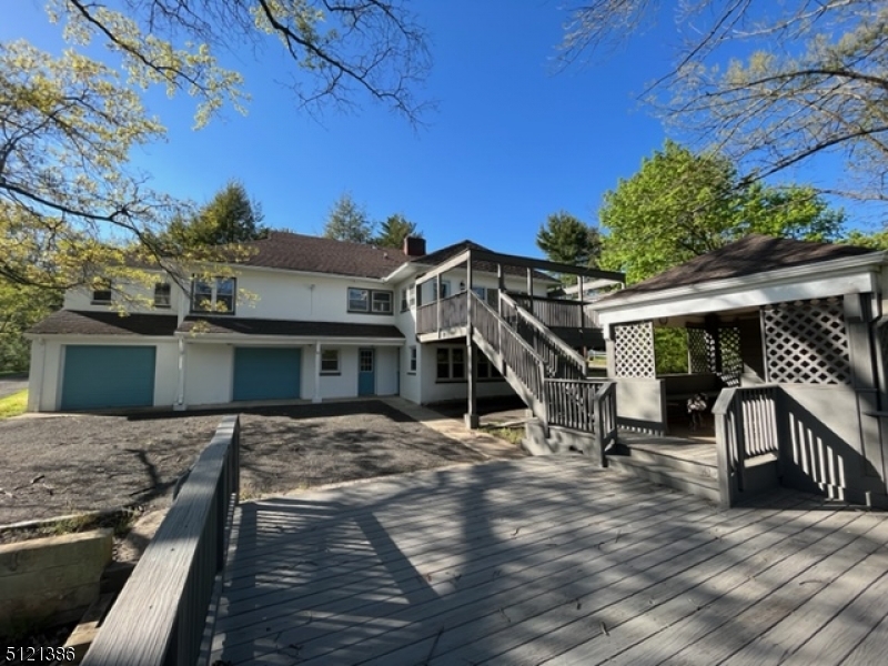 636 Valley Road Watchung, NJ 07069 - Photo 6 of 43 a view of a house with a wooden deck