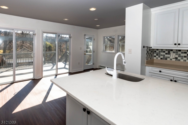 636 Valley Road Watchung, NJ 07069 - Photo 9 of 43 a bedroom with a bed and large window with balcony view