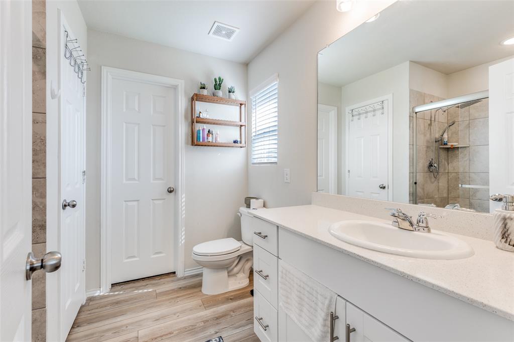 16024 Pemberly Lane Haslet, TX 76052 - Photo 19 of 23 a bathroom with a sink toilet and shower