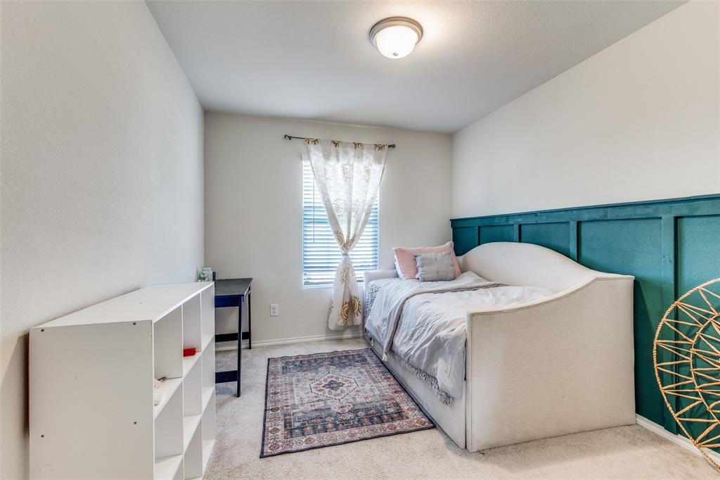 16024 Pemberly Lane Haslet, TX 76052 - Photo 20 of 23 a bedroom with a bed and a window