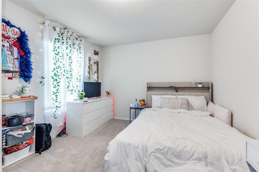 16024 Pemberly Lane Haslet, TX 76052 - Photo 21 of 23 a bedroom with a bed and a window