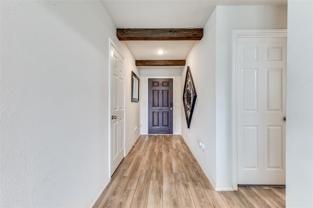 16024 Pemberly Lane Haslet, TX 76052 - Photo 4 of 23 a view of a hallway with wooden floor and entryway