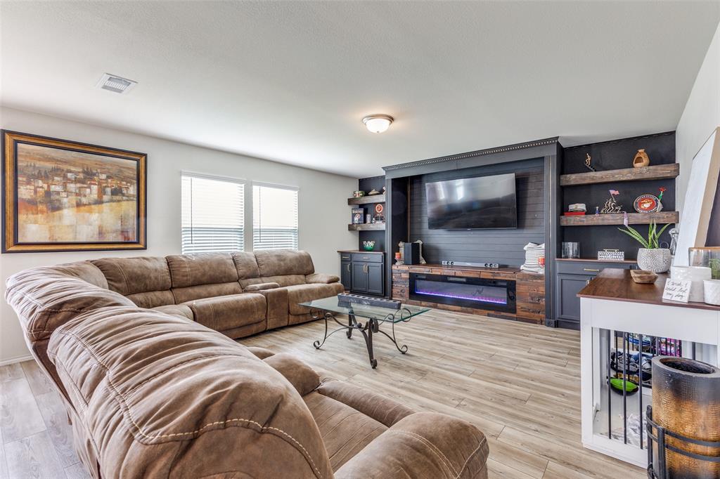16024 Pemberly Lane Haslet, TX 76052 - Photo 5 of 23 a living room with furniture and a flat screen tv