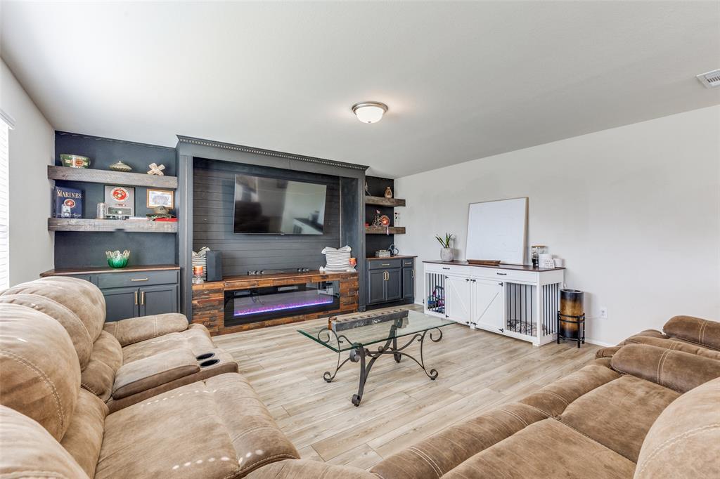 16024 Pemberly Lane Haslet, TX 76052 - Photo 6 of 23 a living room with furniture and a flat screen tv