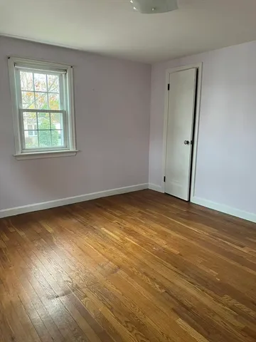 a view of room with hardwood floor