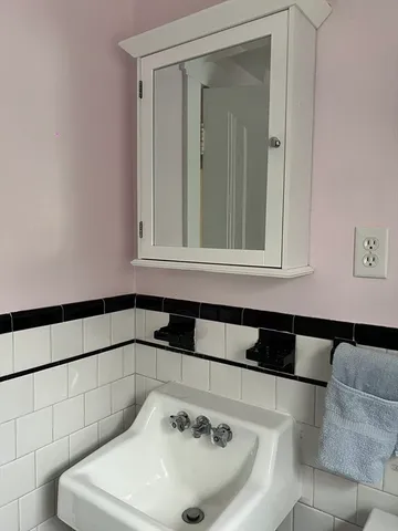 a bathroom with a shower and a tub