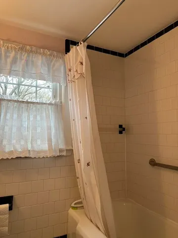 a room with a table chairs and wooden floor