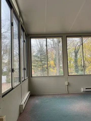 a dining room with furniture water view and a fireplace