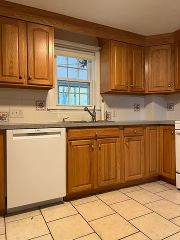 a kitchen with a stove a washer and dryer
