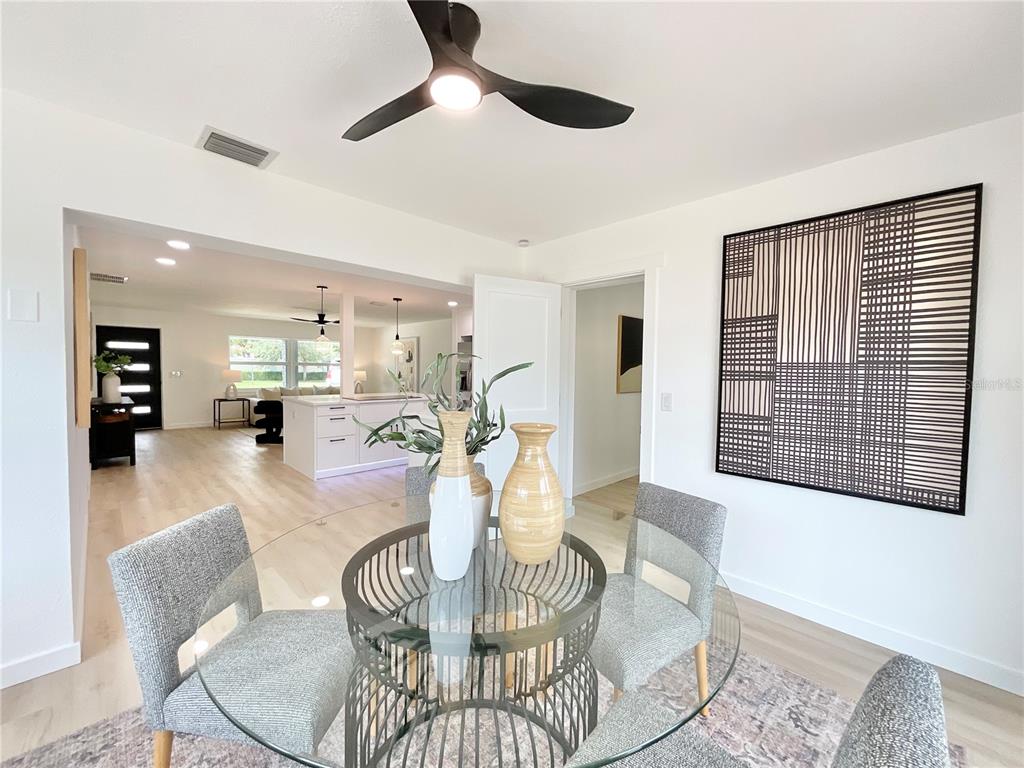 1290 Michigan Boulevard Dunedin, FL 34698 - Photo 15 of 45 a view of a dining room with furniture